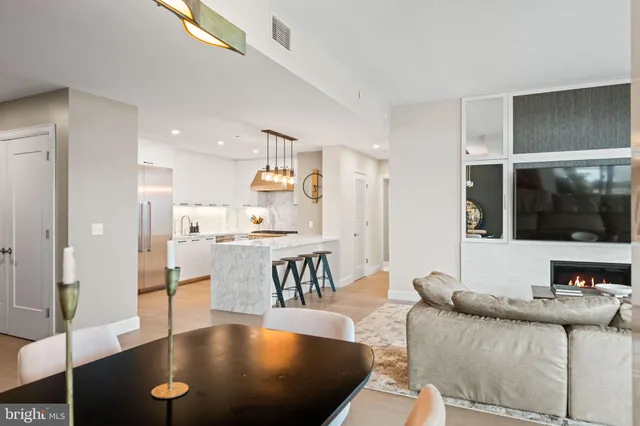 a bedroom with a bed and a flat tv screen on the dresser