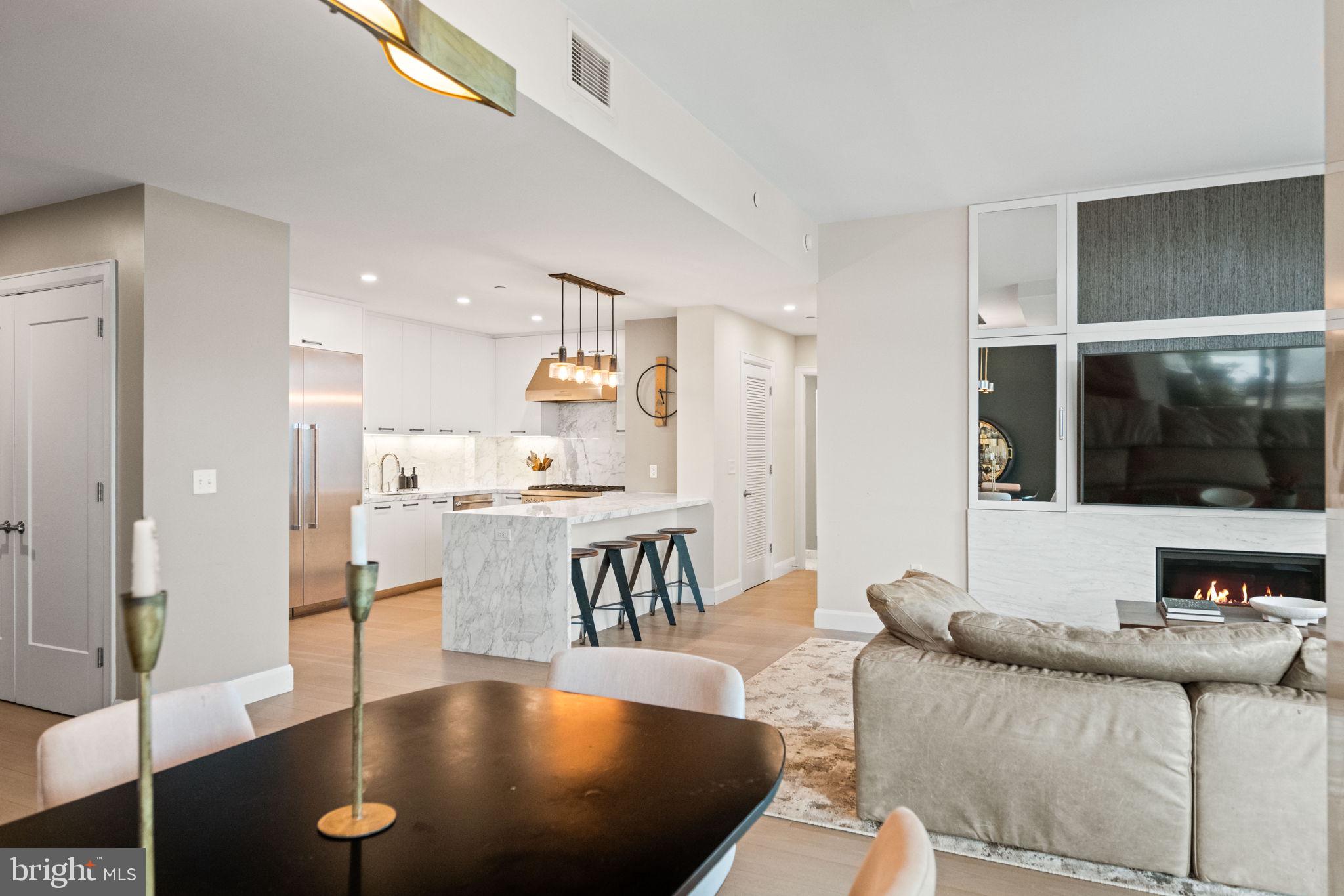 1330 Lancaster Street, Unit C603 Baltimore, MD 21231 - Photo 21 of 63 a living room with furniture and a flat screen tv