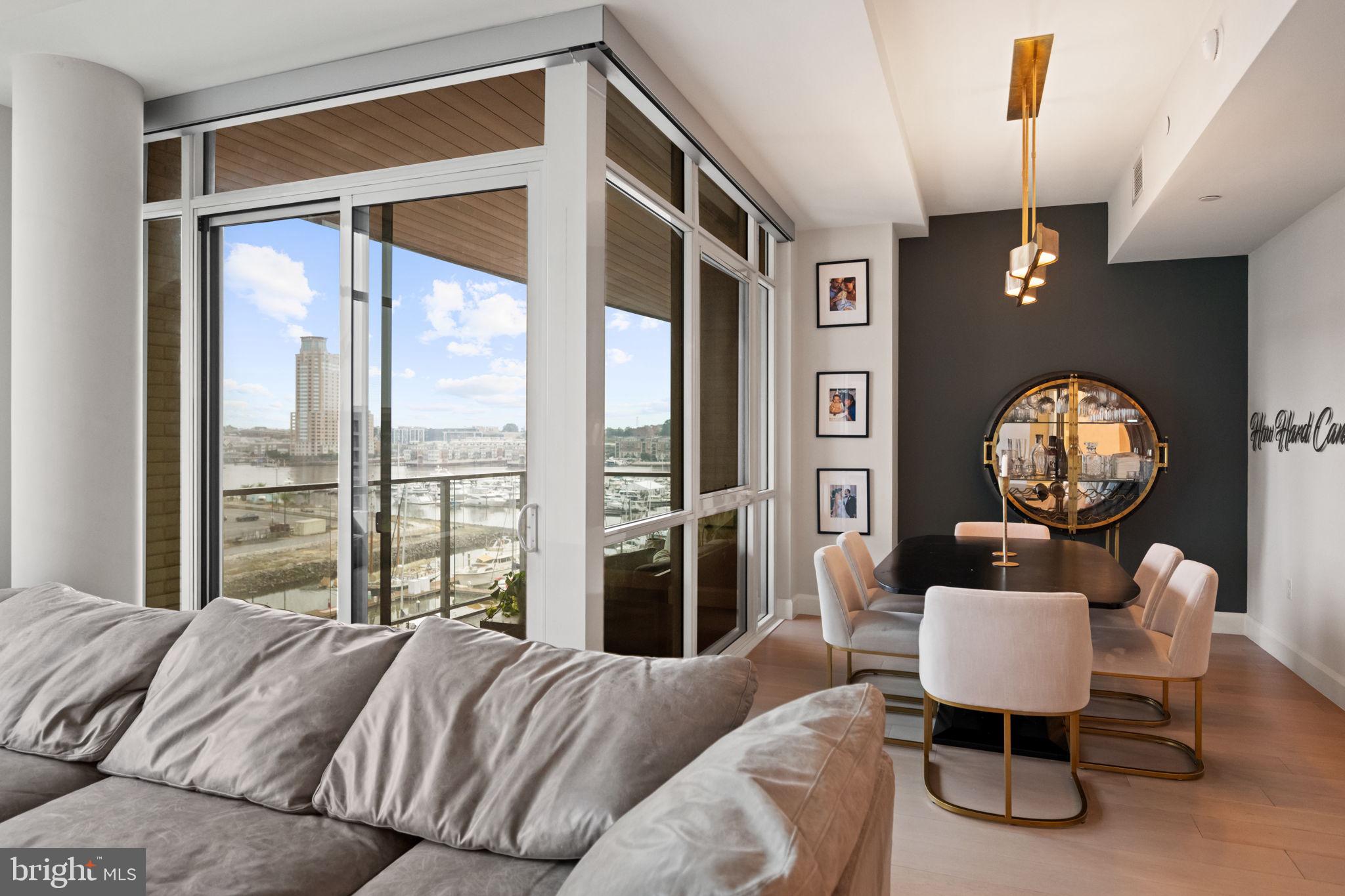 1330 Lancaster Street, Unit C603 Baltimore, MD 21231 - Photo 22 of 63 a bedroom with a bed window and a mirror