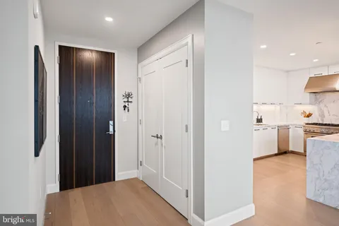a bathroom with a double vanity sink mirror and shower