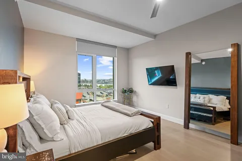 a view of walk in closet with clothes