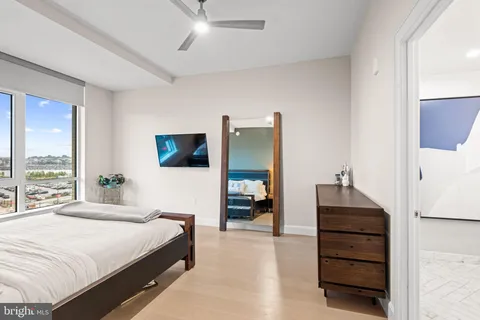 a bathroom with double vanity sinks and a mirror