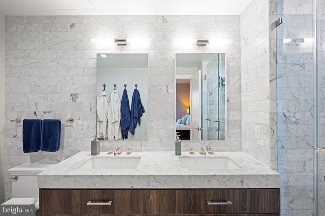 a balcony with furniture and a floor to ceiling window