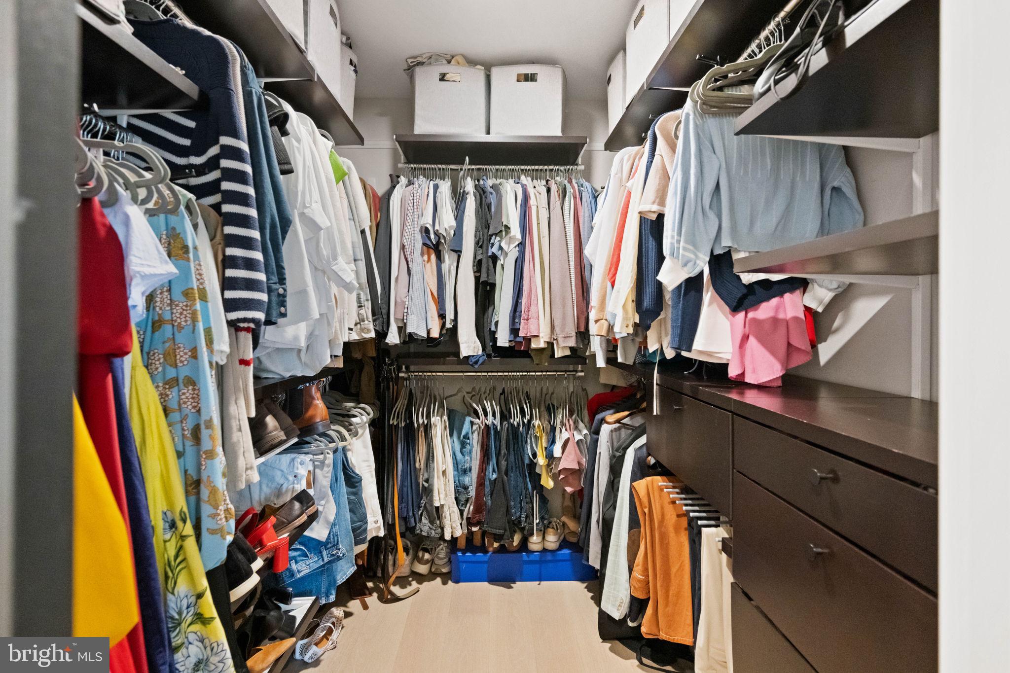 1330 Lancaster Street, Unit C603 Baltimore, MD 21231 - Photo 31 of 63 a view of walk in closet with clothes