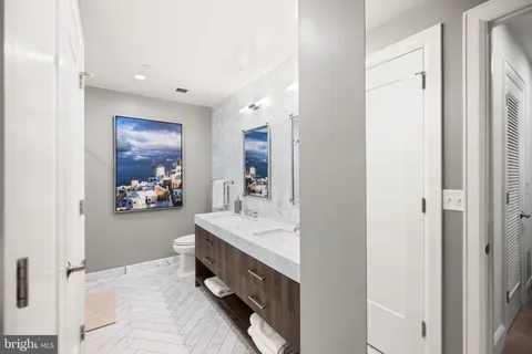 a view of swimming pool with outdoor seating and city view