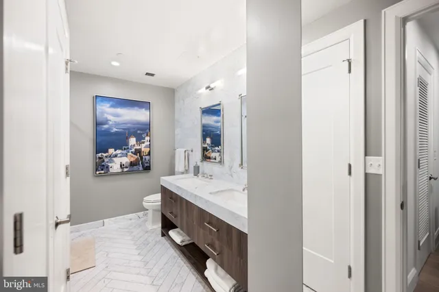 a view of swimming pool with outdoor seating and city view