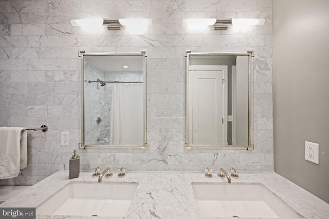 a view of a patio with a table and chairs