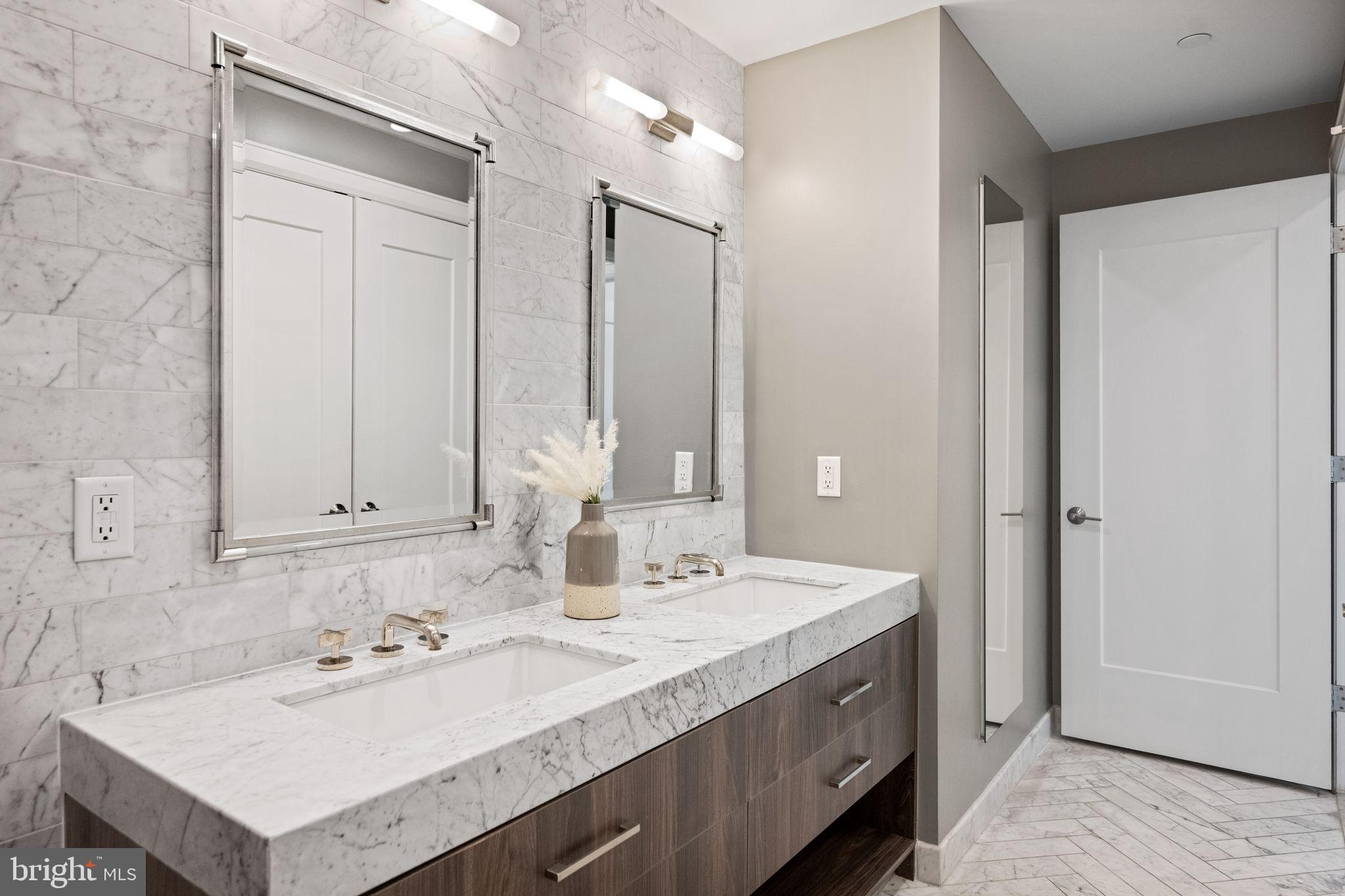 1330 Lancaster Street, Unit C603 Baltimore, MD 21231 - Photo 37 of 59 a bathroom with a sink double vanity and a mirror