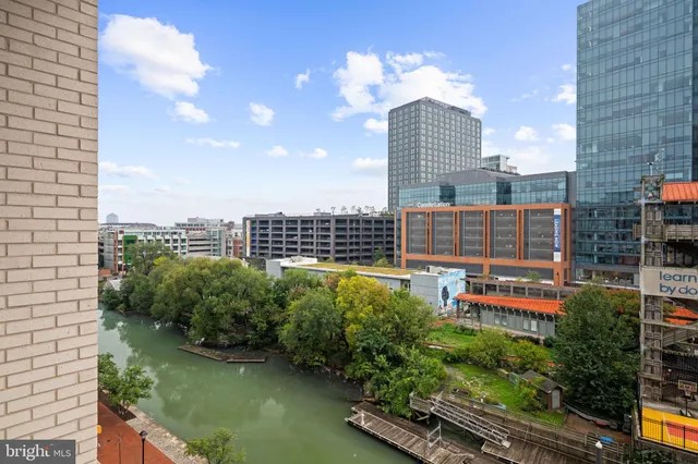 a room with lots of wooden furniture and glass table