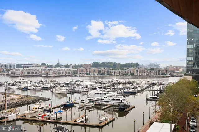 a view of a swimming pool with outdoor seating