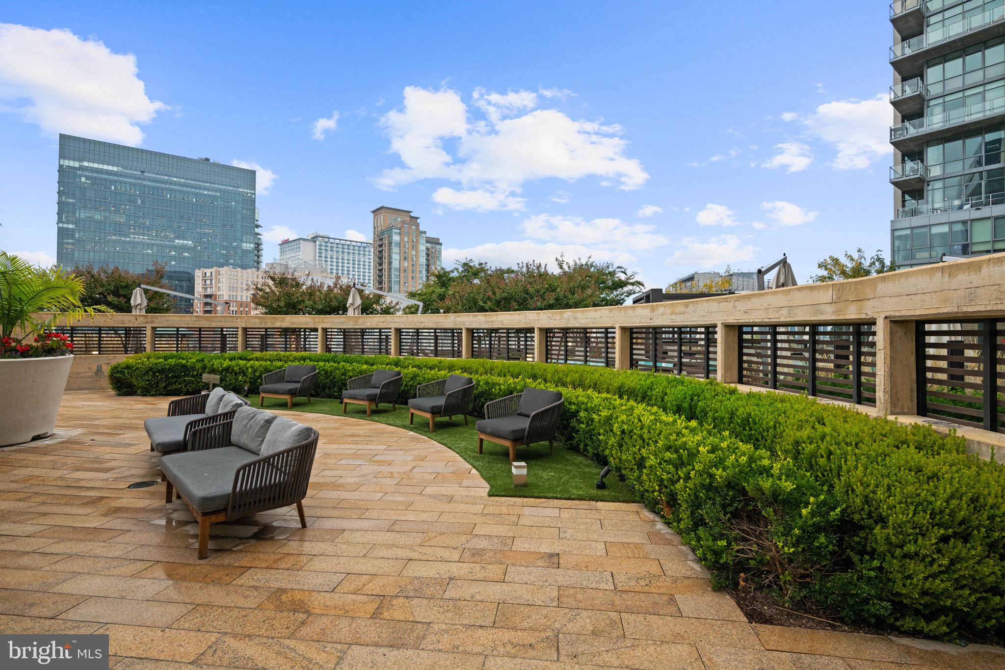 1330 Lancaster Street, Unit C603 Baltimore, MD 21231 - Photo 43 of 63 a view of a patio with a table and chairs
