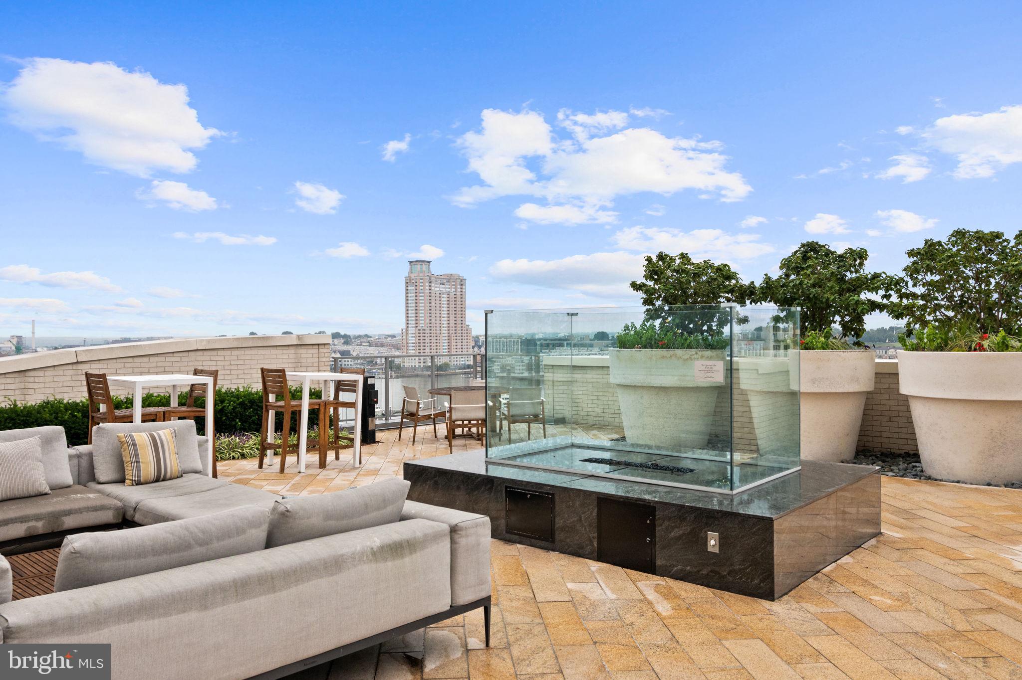 1330 Lancaster Street, Unit C603 Baltimore, MD 21231 - Photo 44 of 63 a view of a terrace with lawn chairs