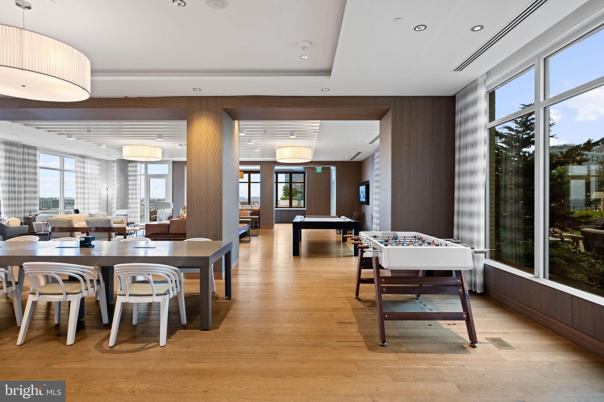 1330 Lancaster Street, Unit C603 Baltimore, MD 21231 - Photo 45 of 63 a room with lots of wooden furniture and glass table