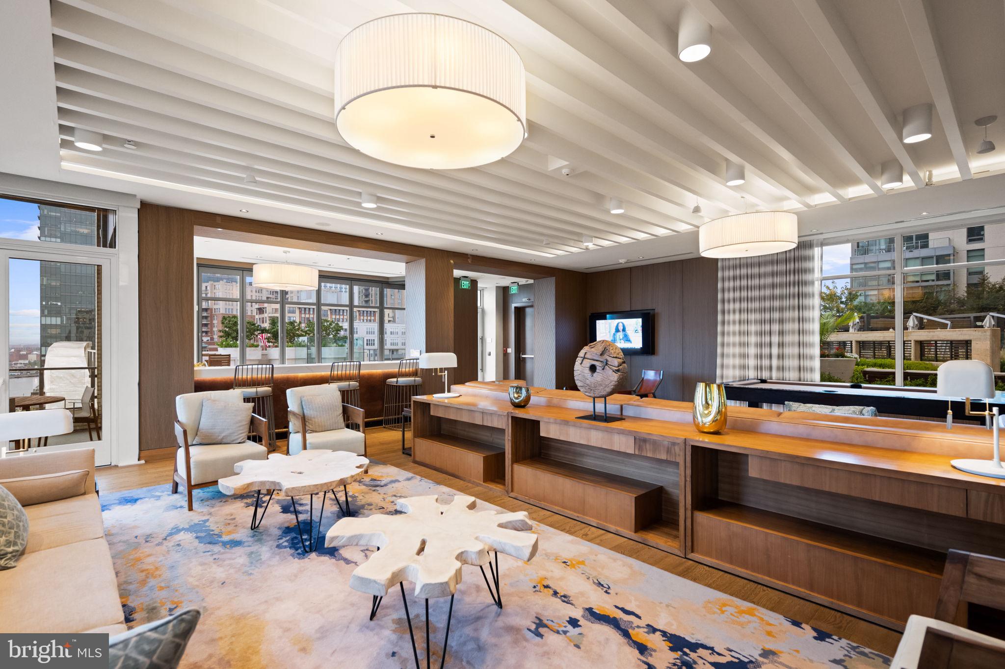 1330 Lancaster Street, Unit C603 Baltimore, MD 21231 - Photo 46 of 63 a living room with furniture and a large window