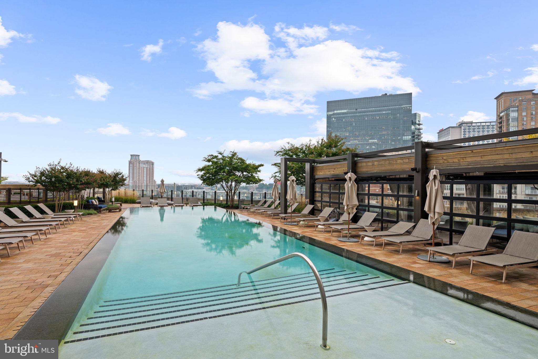 1330 Lancaster Street, Unit C603 Baltimore, MD 21231 - Photo 5 of 63 a view of a swimming pool with outdoor seating
