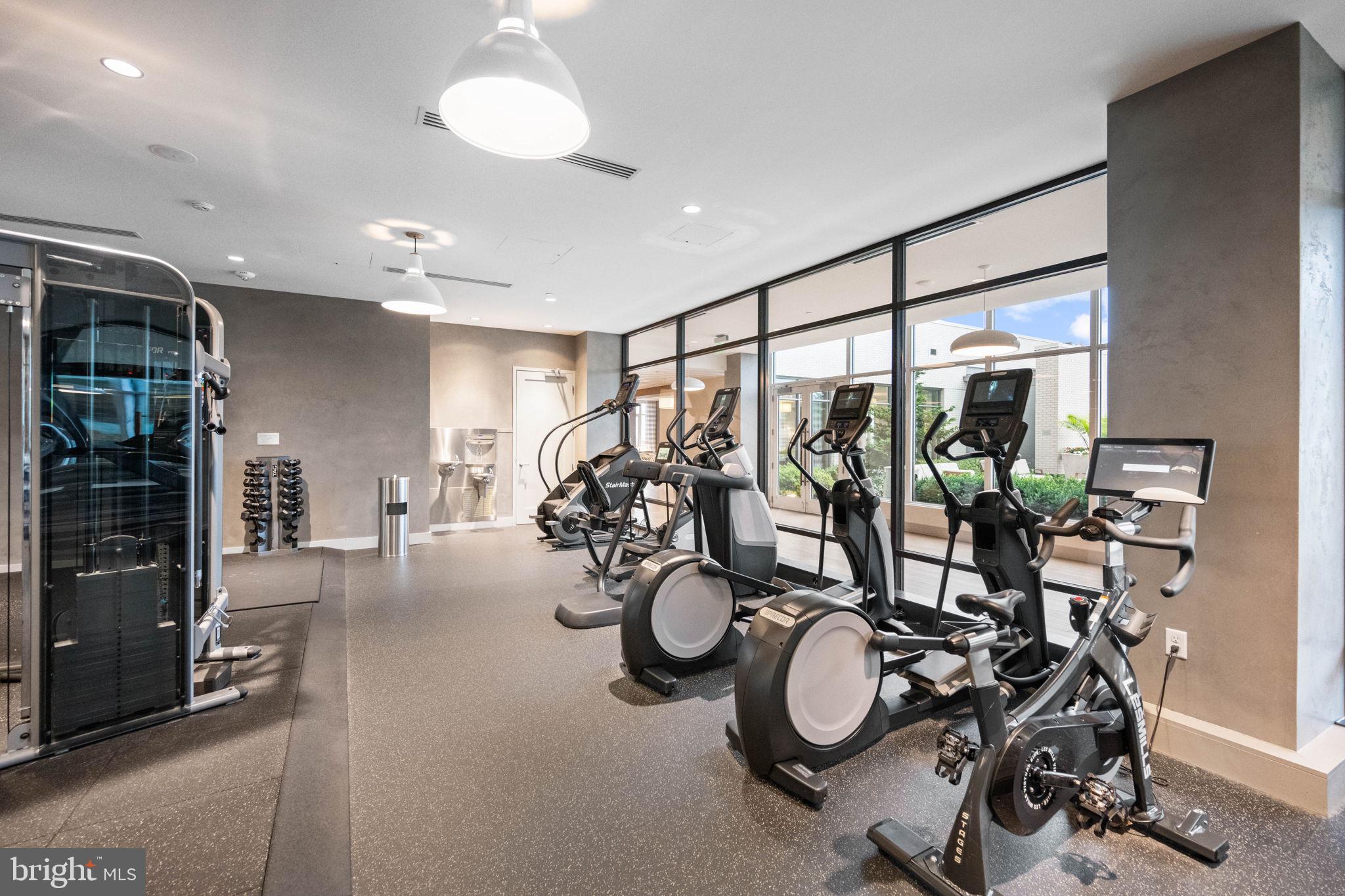 1330 Lancaster Street, Unit C603 Baltimore, MD 21231 - Photo 54 of 59 a very nice looking room with gym equipment and windows