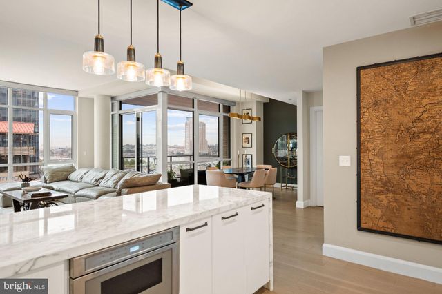 a kitchen with cabinets and stainless steel appliances