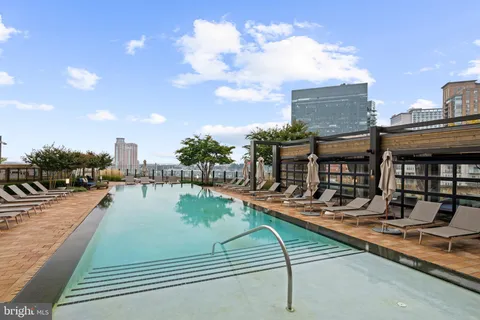 a view of a swimming pool with a lounge chairs