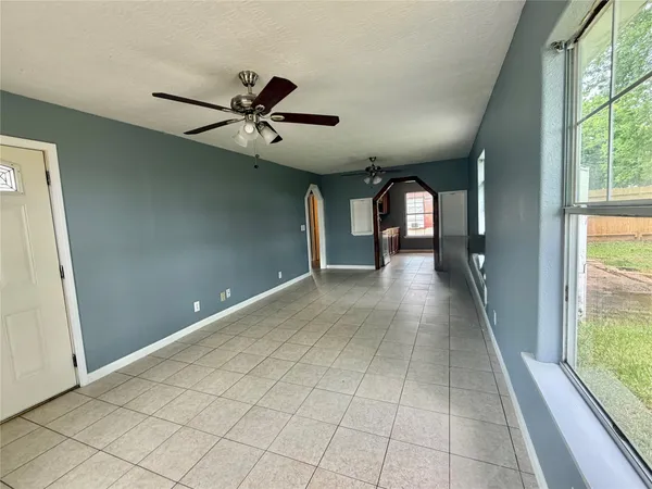 a view of a hallway with windows