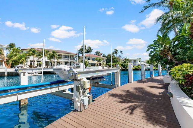 a kitchen with stainless steel appliances granite countertop sink stove and large window