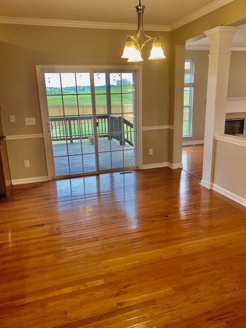 3018 Langston Place Spring Hill, TN 37174 - Photo 12 of 33 a view of a room with wooden floor and chandelier