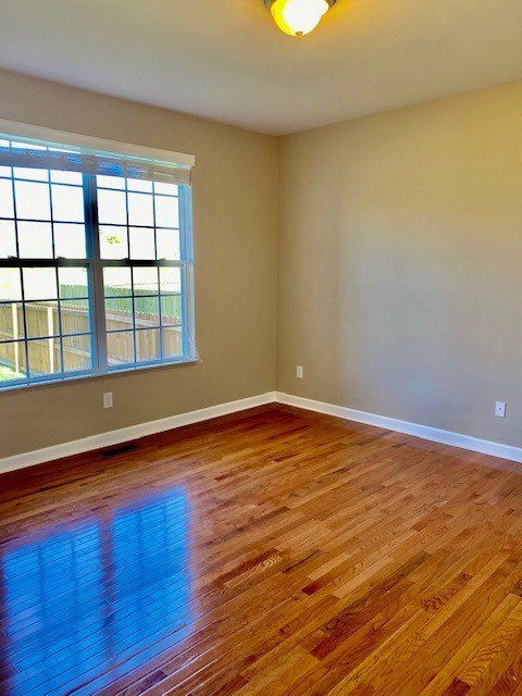 3018 Langston Place Spring Hill, TN 37174 - Photo 13 of 33 a view of empty room with wooden floor and fan
