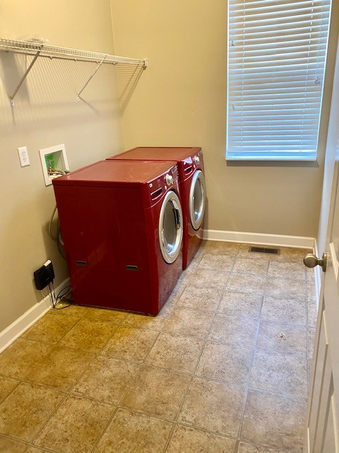 3018 Langston Place Spring Hill, TN 37174 - Photo 14 of 33 a bathroom with a sink and a washer