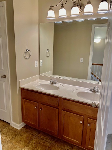 3018 Langston Place Spring Hill, TN 37174 - Photo 17 of 33 a bathroom with a sink double vanity and a mirror