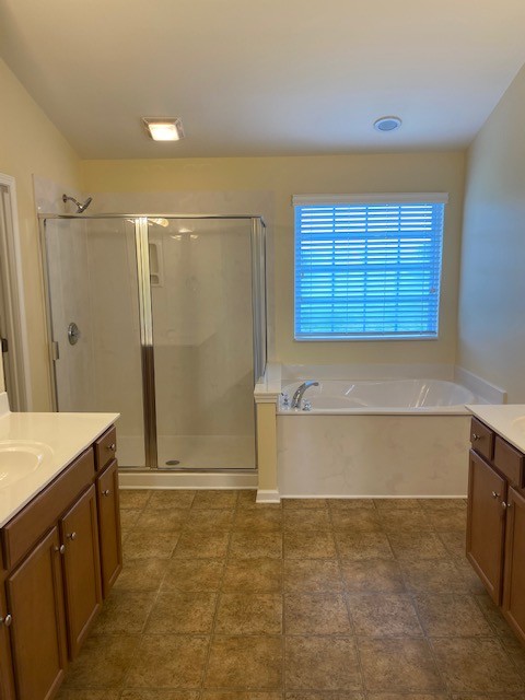 3018 Langston Place Spring Hill, TN 37174 - Photo 23 of 33 a bathroom with a shower and a bathtub