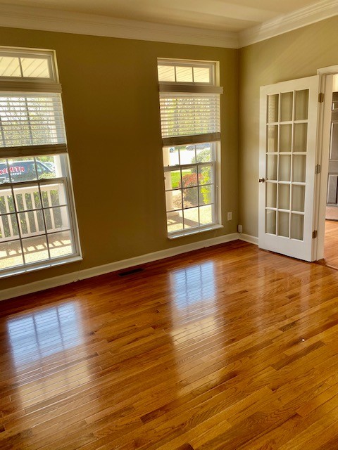 3018 Langston Place Spring Hill, TN 37174 - Photo 4 of 33 a view of an empty room with wooden floor and a window