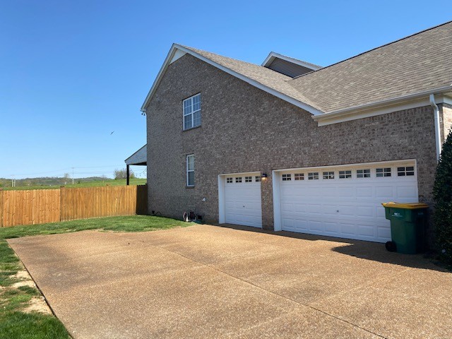 3018 Langston Place Spring Hill, TN 37174 - Photo 33 of 33 a front view of a house with a yard