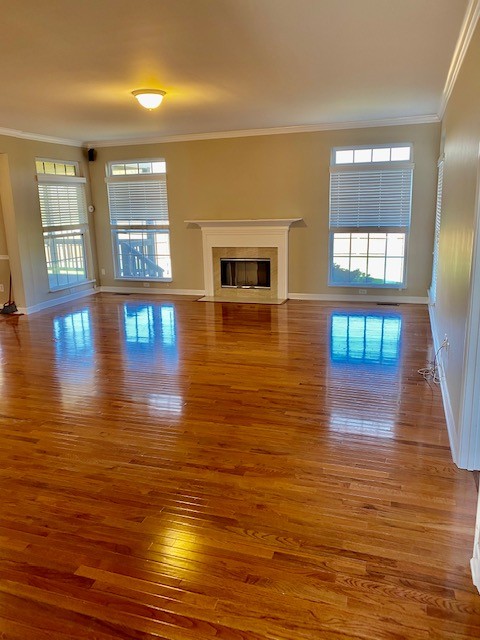 3018 Langston Place Spring Hill, TN 37174 - Photo 8 of 33 a view of empty room with wooden floor and windows