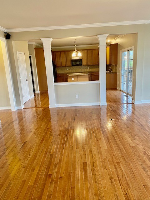 3018 Langston Place Spring Hill, TN 37174 - Photo 9 of 33 a view of a kitchen with wooden floors and a sink