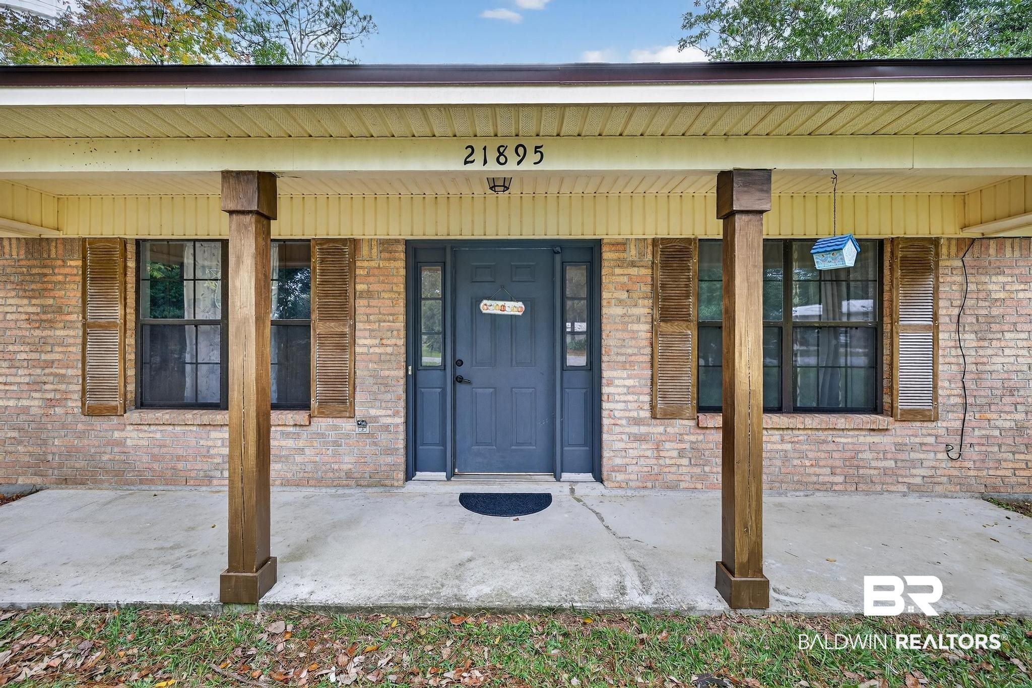 21895 2nd Street Silverhill, AL 36576 - Photo 5 of 43 View of exterior entry with covered porch and brick siding