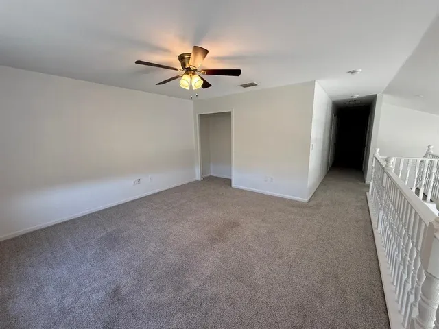 an empty room with a empty space and a window