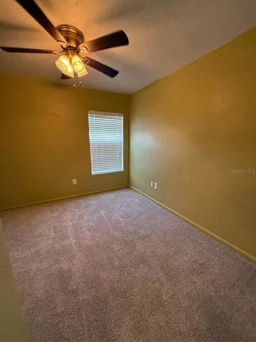 a view of swimming pool from a balcony