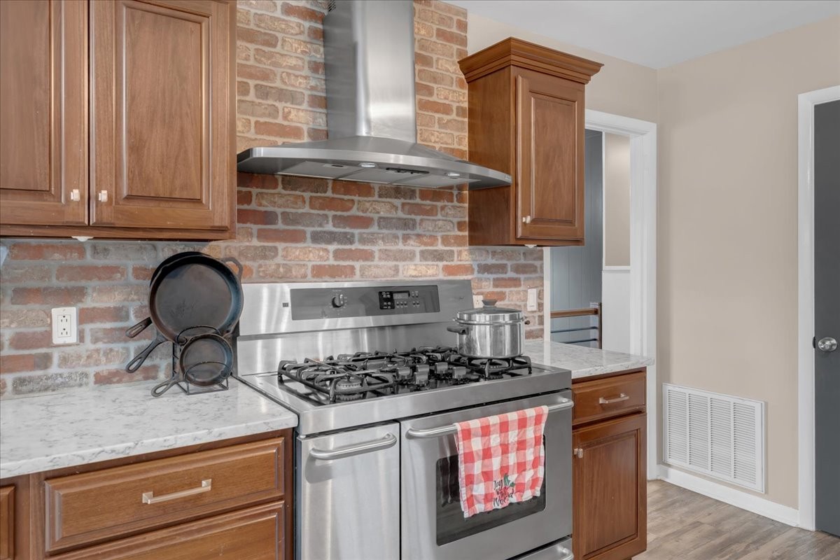 1007 Sycamore Drive Manchester, TN 37355 - Photo 12 of 100 a kitchen with granite countertop a stove and a sink