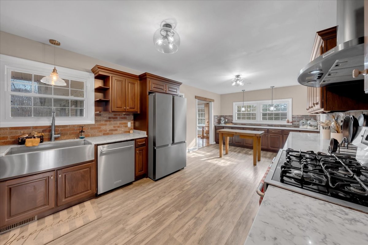 1007 Sycamore Drive Manchester, TN 37355 - Photo 15 of 100 a kitchen with stainless steel appliances granite countertop a stove refrigerator and a sink