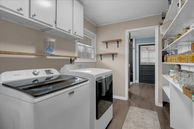 a spacious bathroom with a granite countertop sink a toilet and a mirror