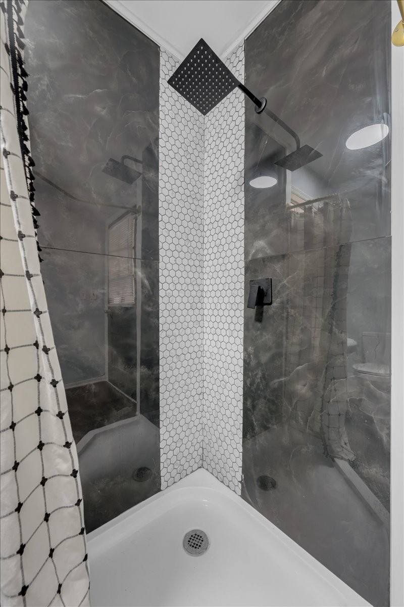 1007 Sycamore Drive Manchester, TN 37355 - Photo 25 of 100 a bathroom with a bathtub and a shower