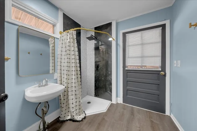 a bathroom with a sink mirror vanity and toilet