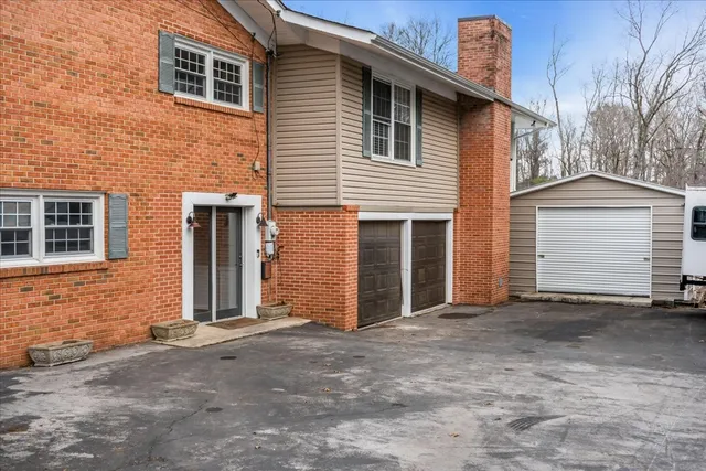 a front view of a house with a garage