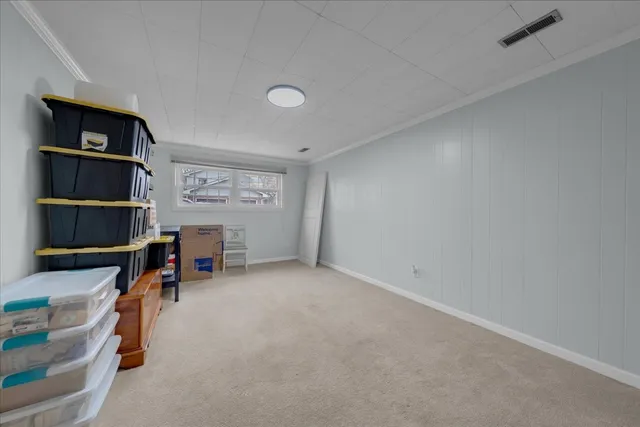 a view of a patio with couches and a dining table and chairs with outer view