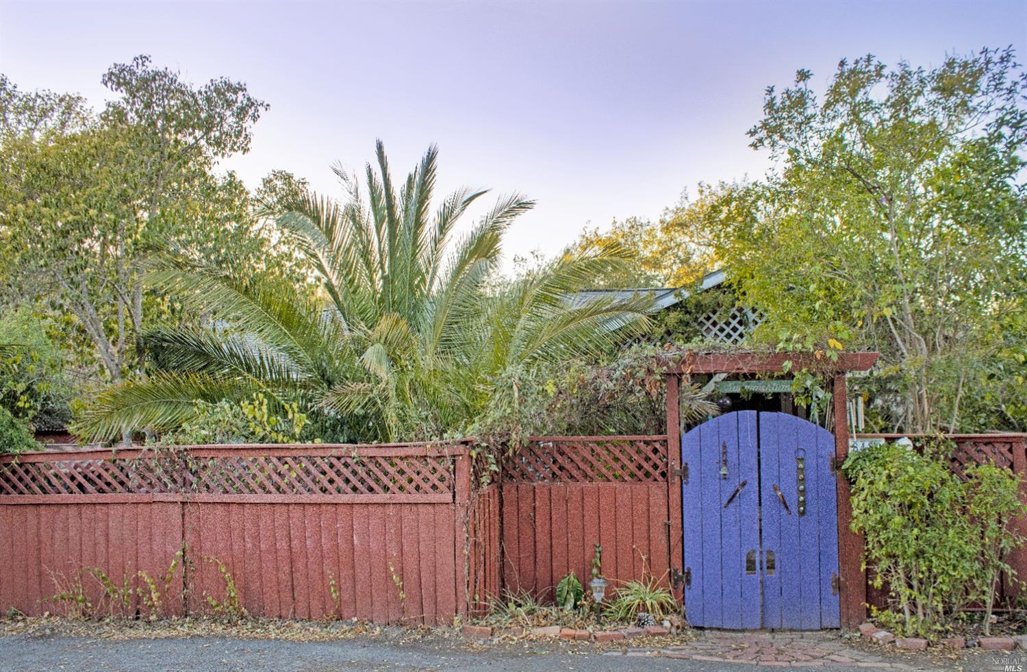 8480 Orchard Road Forestville, CA 95436 - Photo 1 of 1 a view of a backyard with wooden fence