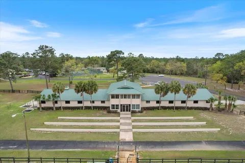 a view of a park with large trees