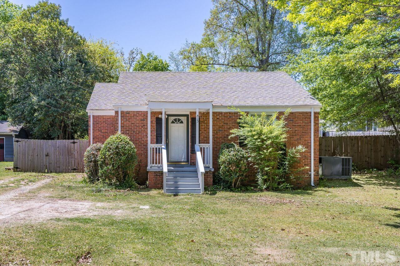 813 North King Charles Road Raleigh, NC 27610 - Photo 1 of 20 a view of a house with a yard and plants