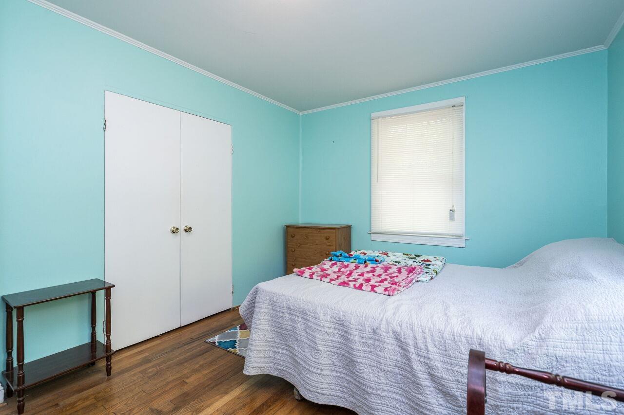 813 North King Charles Road Raleigh, NC 27610 - Photo 11 of 20 a bedroom with a bed and a window