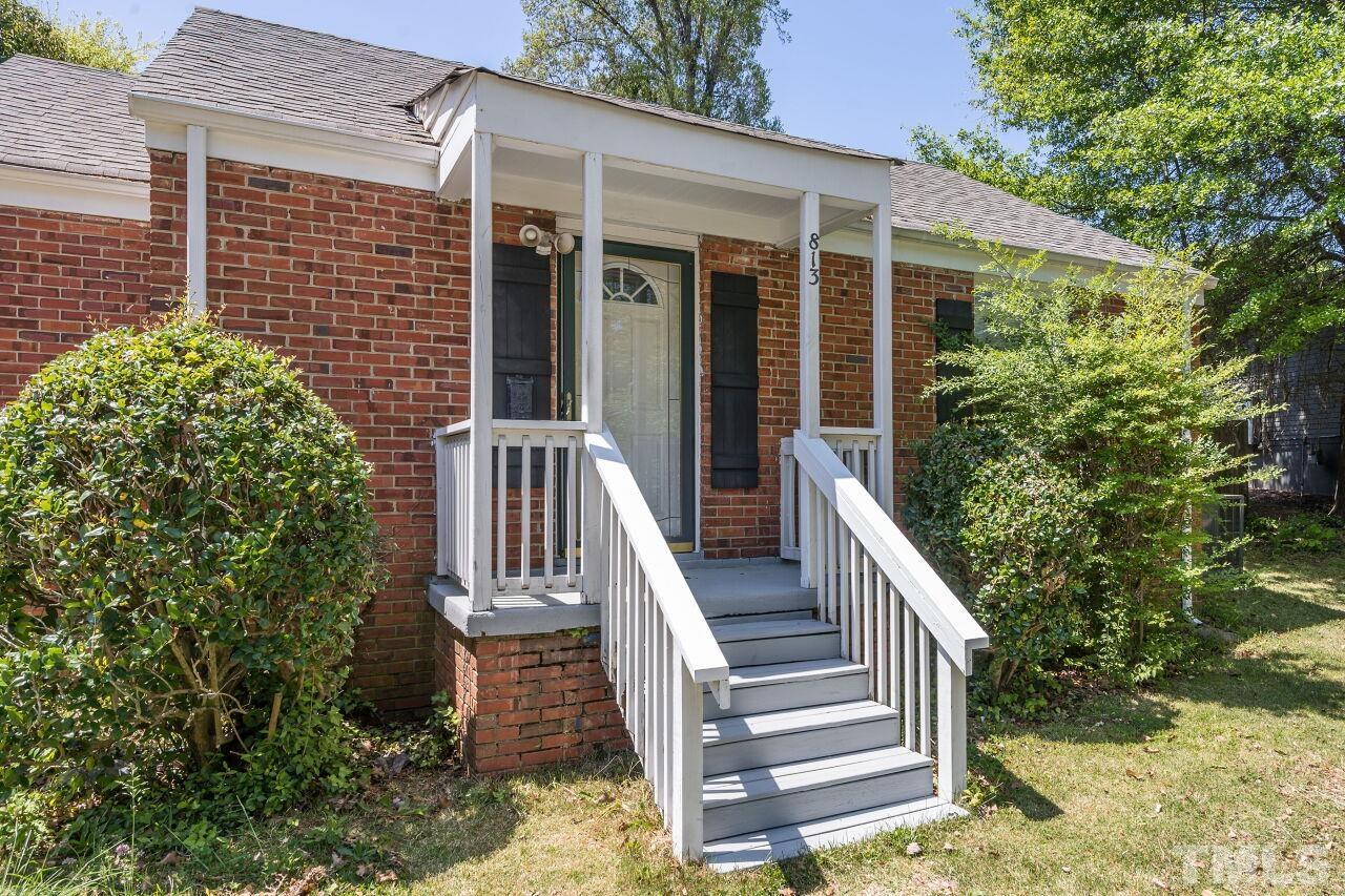 813 North King Charles Road Raleigh, NC 27610 - Photo 2 of 20 a view of a house with backyard and porch