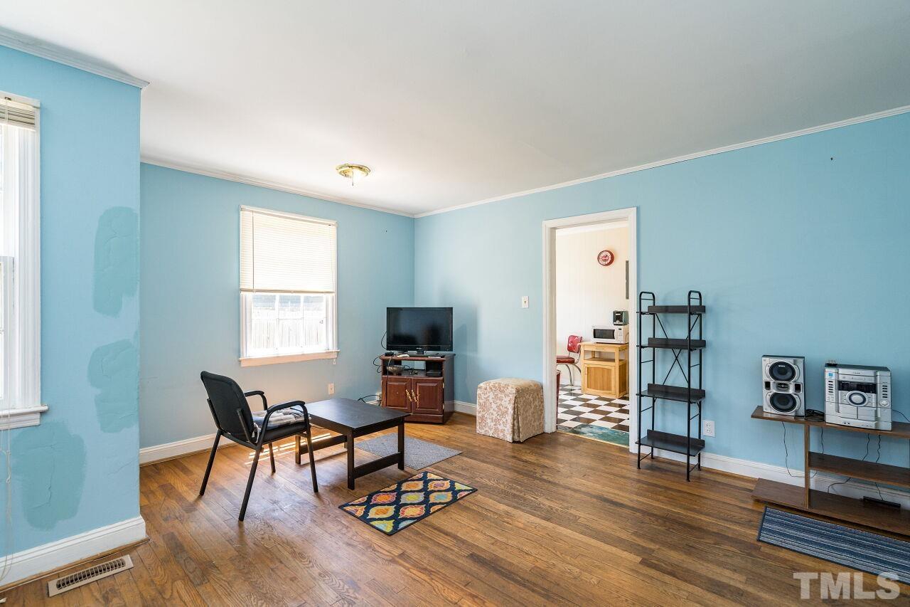 813 North King Charles Road Raleigh, NC 27610 - Photo 3 of 20 a workspace with furniture and a window