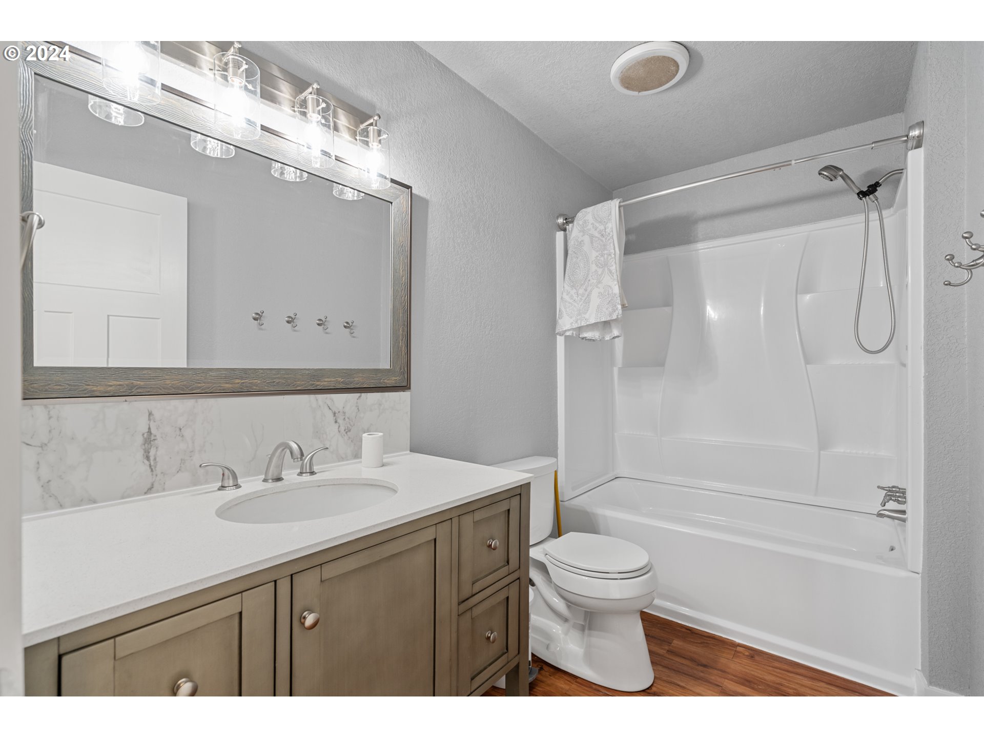 805 Southwest 28th Street Pendleton, OR 97801 - Photo 15 of 25 a bathroom with a sink a toilet and a large mirror